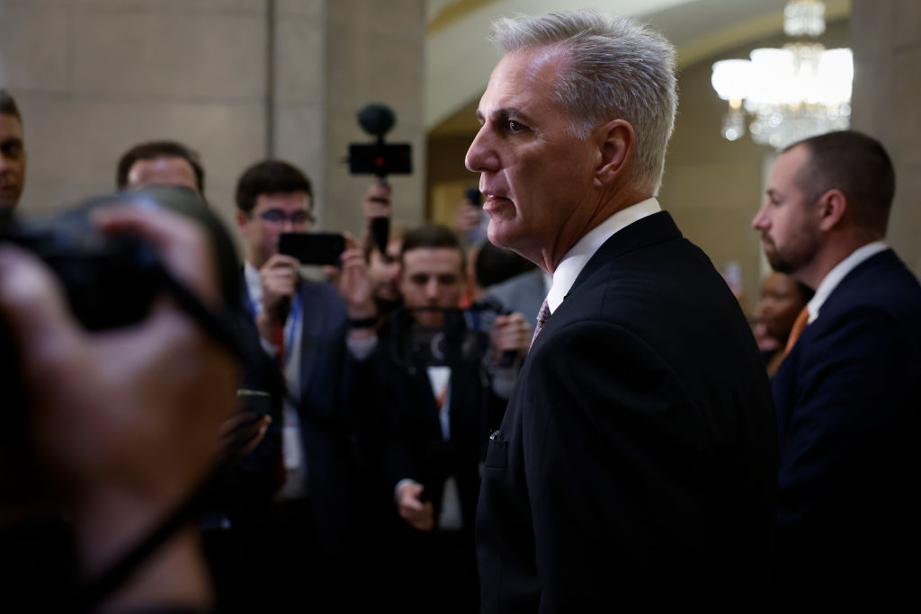 Speaker Kevin McCarthy talks to reporters inside the Capitol building.