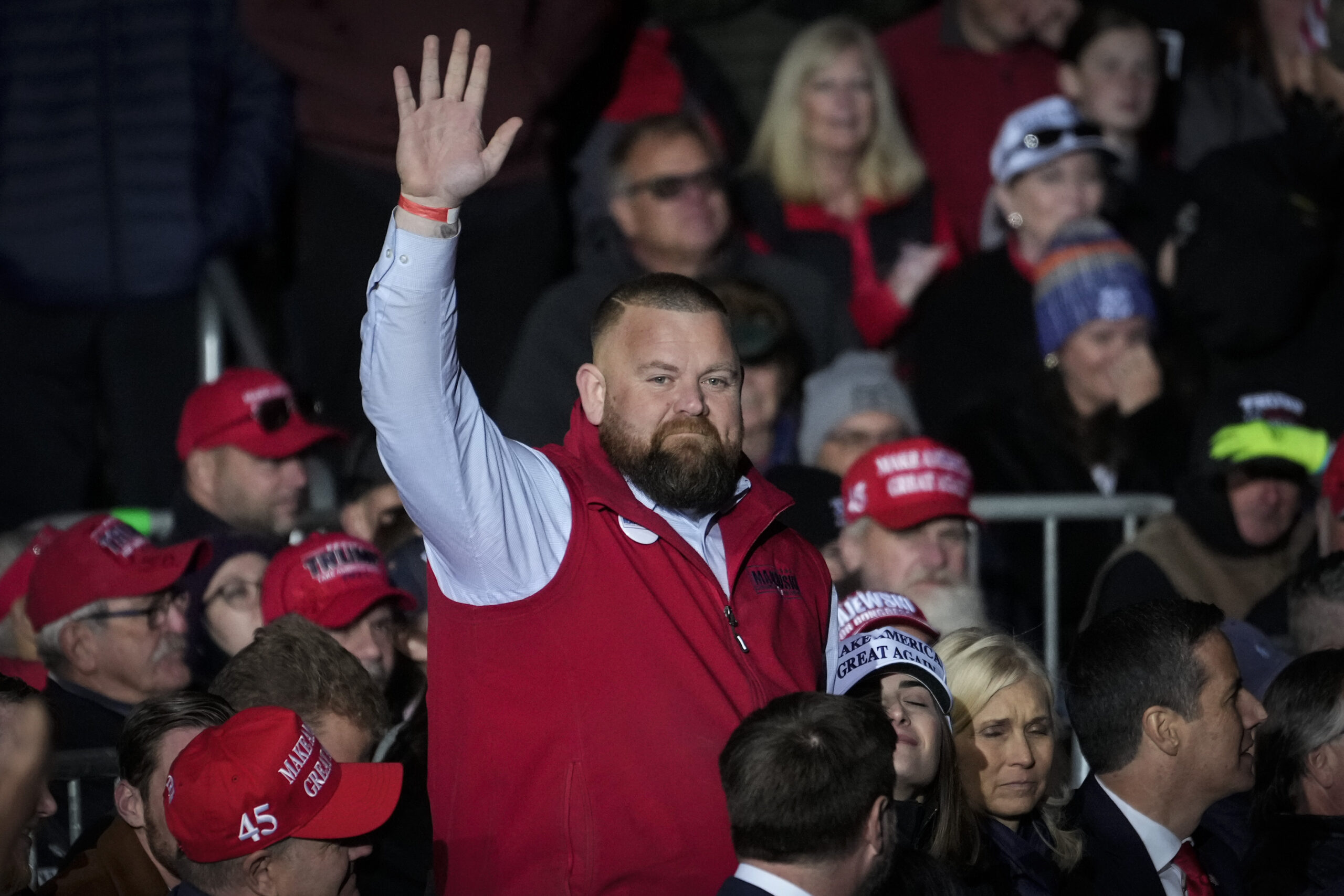 Republican Congressional candidate J.R. Majewski acknowledges the crowd after being introduced by former President Donald Trump at a rally for Ohio Republicans.