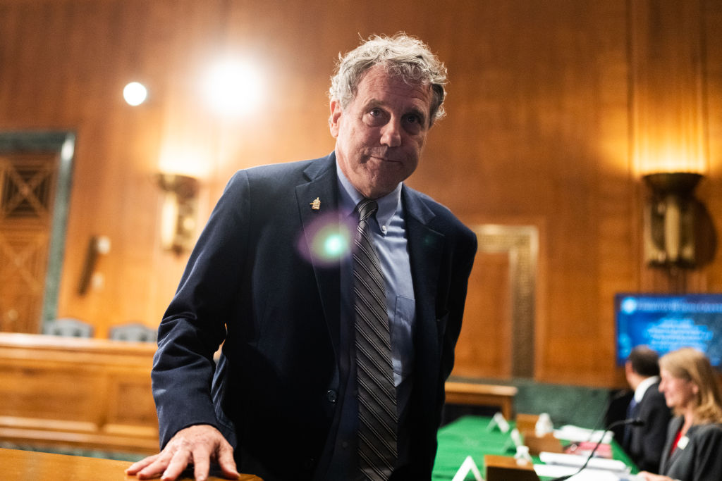 Sherrod Brown arrives for a Senate Banking, Housing and Urban Affairs Committee hearing.